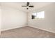 Bedroom with ceiling fan, window, and neutral carpeting at 7118 E Arbor Ave, Mesa, AZ 85208