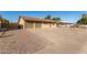 Exterior view of a single-story home with a driveway and landscaping at 7118 E Arbor Ave, Mesa, AZ 85208