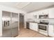 Modern kitchen featuring stainless steel appliances and light wood flooring at 7118 E Arbor Ave, Mesa, AZ 85208