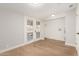 Laundry room with French doors and wood-look flooring at 7118 E Arbor Ave, Mesa, AZ 85208