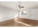 Bright living room featuring hardwood floors and a ceiling fan at 7118 E Arbor Ave, Mesa, AZ 85208