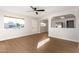 Open living area with hardwood floors and a view into the kitchen at 7118 E Arbor Ave, Mesa, AZ 85208