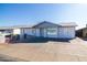 Newly painted home with a spacious front yard and driveway at 7217 W Claremont St, Glendale, AZ 85303