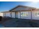 Newly painted home with a covered porch at 7217 W Claremont St, Glendale, AZ 85303