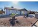 Cute one-story home with a rock front yard at 7217 W Claremont St, Glendale, AZ 85303