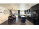 Modern kitchen with dark cabinetry and breakfast nook at 7217 W Claremont St, Glendale, AZ 85303