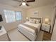 Second bedroom featuring a queen-size bed and light wood floors at 749 E Montebello Ave # 130, Phoenix, AZ 85014