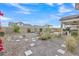 Landscaped backyard showcasing a rectangular pool, stone pathway, and desert plants at 8043 E Jaeger St, Mesa, AZ 85207