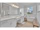 Spa-like bathroom with double vanity, large shower, and soaking tub at 8043 E Jaeger St, Mesa, AZ 85207