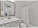 Clean bathroom with a single vanity, toilet, and shower/tub combo at 8043 E Jaeger St, Mesa, AZ 85207