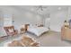 Bright bedroom with mid-century modern furniture and en-suite bathroom at 8043 E Jaeger St, Mesa, AZ 85207