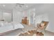 Bright bedroom with mid-century modern furniture and en-suite bathroom at 8043 E Jaeger St, Mesa, AZ 85207