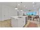 Kitchen island with white cabinets, sink, and dishwasher at 8043 E Jaeger St, Mesa, AZ 85207