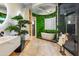 Spa-like bathroom with freestanding tub and green wall at 815 E County Down Dr, Chandler, AZ 85249