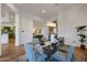 Bright dining room with a glass table and view into the living room and kitchen at 815 E County Down Dr, Chandler, AZ 85249