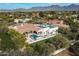 Luxury estate home with pool, expansive lawn, and mountain views at 8515 E Sutton Dr, Scottsdale, AZ 85260