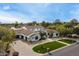 Stunning estate home with circular driveway and lush landscaping at 8515 E Sutton Dr, Scottsdale, AZ 85260