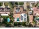 Bird's-eye view of a sprawling estate with a pool and solar panels on the roof at 8515 E Sutton Dr, Scottsdale, AZ 85260