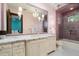 Charming bathroom with pink mosaic tiles and a marble vanity at 8515 E Sutton Dr, Scottsdale, AZ 85260