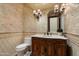 Luxurious powder room with marble vanity and tile at 8515 E Sutton Dr, Scottsdale, AZ 85260