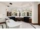 Elegant bathroom with marble vanity, soaking tub, and a large mirror at 8515 E Sutton Dr, Scottsdale, AZ 85260