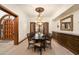 Formal dining room with a chandelier and built-in cabinetry at 8515 E Sutton Dr, Scottsdale, AZ 85260