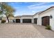 Three-car garage with paver driveway and elegant design at 8515 E Sutton Dr, Scottsdale, AZ 85260