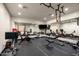 Well-equipped home gym featuring various exercise machines and free weights at 8515 E Sutton Dr, Scottsdale, AZ 85260