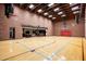 Full-sized indoor basketball court perfect for recreation at 8515 E Sutton Dr, Scottsdale, AZ 85260