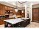 Island kitchen with marble countertops, custom cabinetry, and high-end appliances at 8515 E Sutton Dr, Scottsdale, AZ 85260