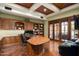 Spacious home office with wood-paneled walls and herringbone floors at 8515 E Sutton Dr, Scottsdale, AZ 85260