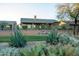 Landscaped backyard with desert plants and a grassy area at 9023 N Crown Ridge --, Fountain Hills, AZ 85268