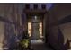 Night view of a house's entryway with a wooden door and stone pathway at 9023 N Crown Ridge --, Fountain Hills, AZ 85268