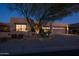 Night view of a tan house with a two-car garage and landscaping at 9023 N Crown Ridge --, Fountain Hills, AZ 85268