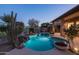 Inviting kidney-shaped pool with waterfall feature and lush landscaping at 9023 N Crown Ridge --, Fountain Hills, AZ 85268