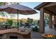 Outdoor kitchen, pool, lounge chairs, and mountain views at 9023 N Crown Ridge --, Fountain Hills, AZ 85268