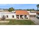 Single story home with a tile roof and attached garage in a residential area at 9031 N 83Rd Way, Scottsdale, AZ 85258