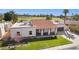 Aerial view of a well-maintained home with a lush lawn and nearby park at 9031 N 83Rd Way, Scottsdale, AZ 85258