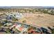 Aerial view of house near park and school with mountain backdrop at 9031 N 83Rd Way, Scottsdale, AZ 85258