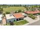 Expansive aerial view of a home with a well-kept lawn and mature landscaping near park at 9031 N 83Rd Way, Scottsdale, AZ 85258