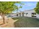 White stucco home with a large backyard, pool, and grassy area at 9031 N 83Rd Way, Scottsdale, AZ 85258