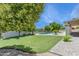 Lush backyard featuring a pristine pool and green lawn, perfect for outdoor entertaining at 9031 N 83Rd Way, Scottsdale, AZ 85258