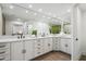 Modern bathroom with double vanity, large mirror, and stylish fixtures at 9031 N 83Rd Way, Scottsdale, AZ 85258