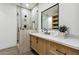 Modern bathroom with walk-in shower and floating vanity at 9031 N 83Rd Way, Scottsdale, AZ 85258