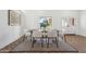 Elegant dining room with wood table and six chairs, featuring hardwood floors at 9031 N 83Rd Way, Scottsdale, AZ 85258