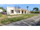 Single-story home with a white exterior and neatly landscaped front yard at 9031 N 83Rd Way, Scottsdale, AZ 85258