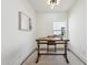 Bright home office features a rustic wood desk and a large window at 9031 N 83Rd Way, Scottsdale, AZ 85258