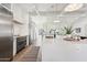 Modern kitchen with marble island and stainless steel appliances at 9031 N 83Rd Way, Scottsdale, AZ 85258