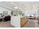 Open kitchen with light wood cabinets and marble island at 9031 N 83Rd Way, Scottsdale, AZ 85258