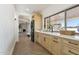 Bright laundry room with stackable washer and dryer, and a view to backyard at 9031 N 83Rd Way, Scottsdale, AZ 85258